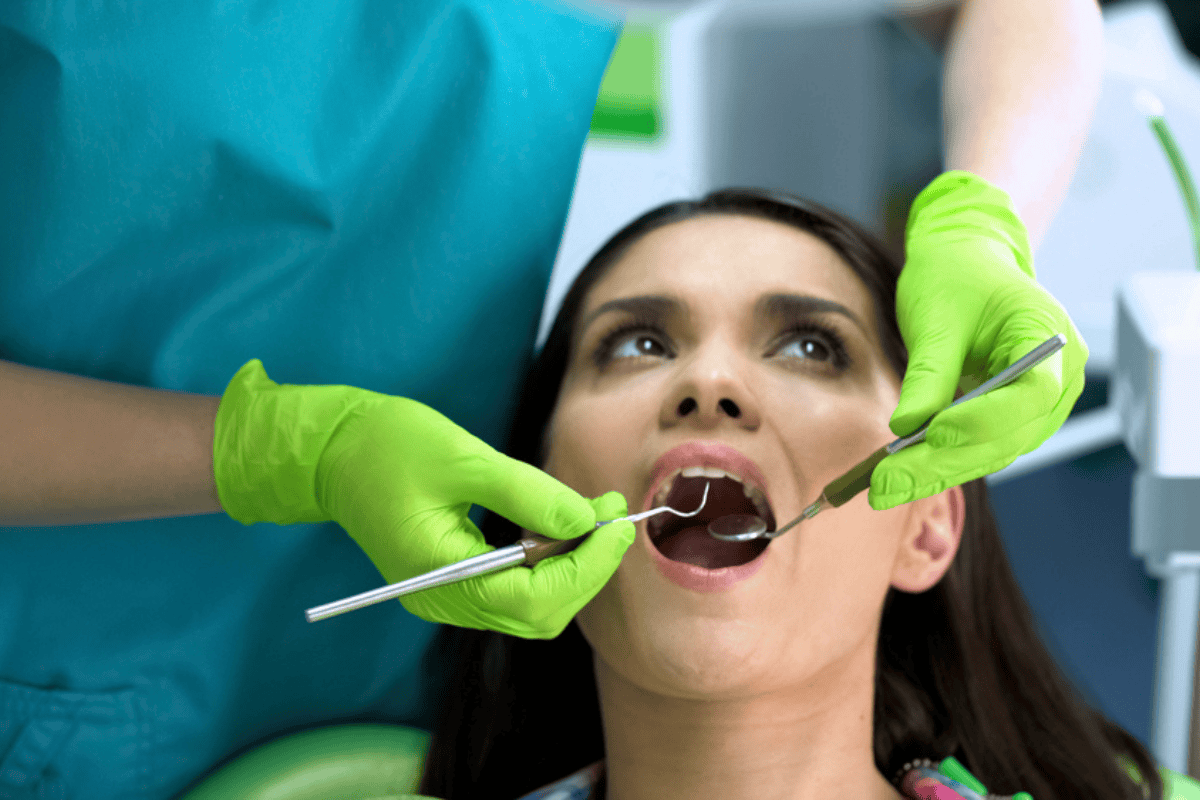 Dentist performing a routine dental checkup to ensure long-term oral health and prevent dental issues